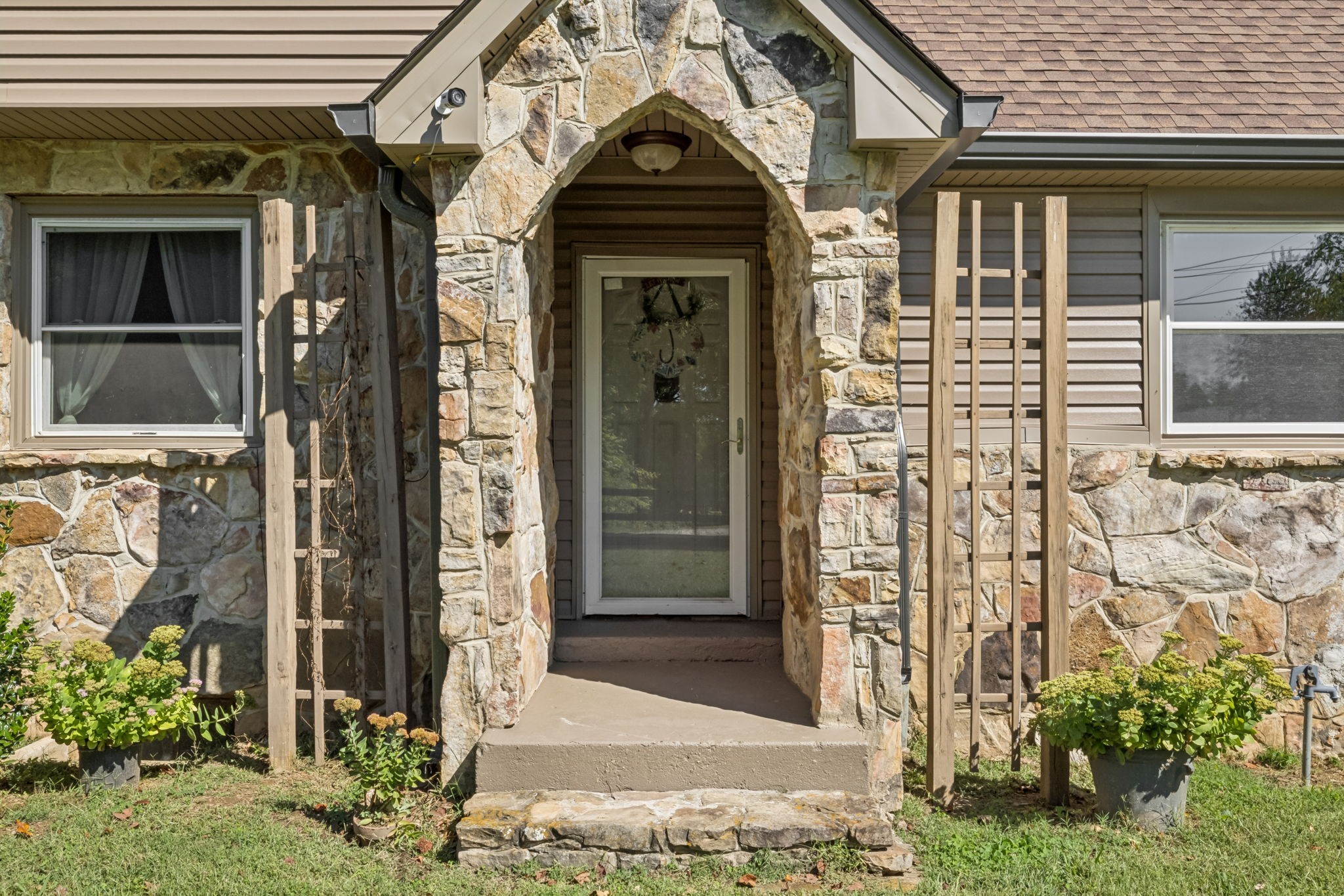 701 Hafner Road Charlotte, TN 37036 - Photo 3 of 52 front view of a brick house with a window