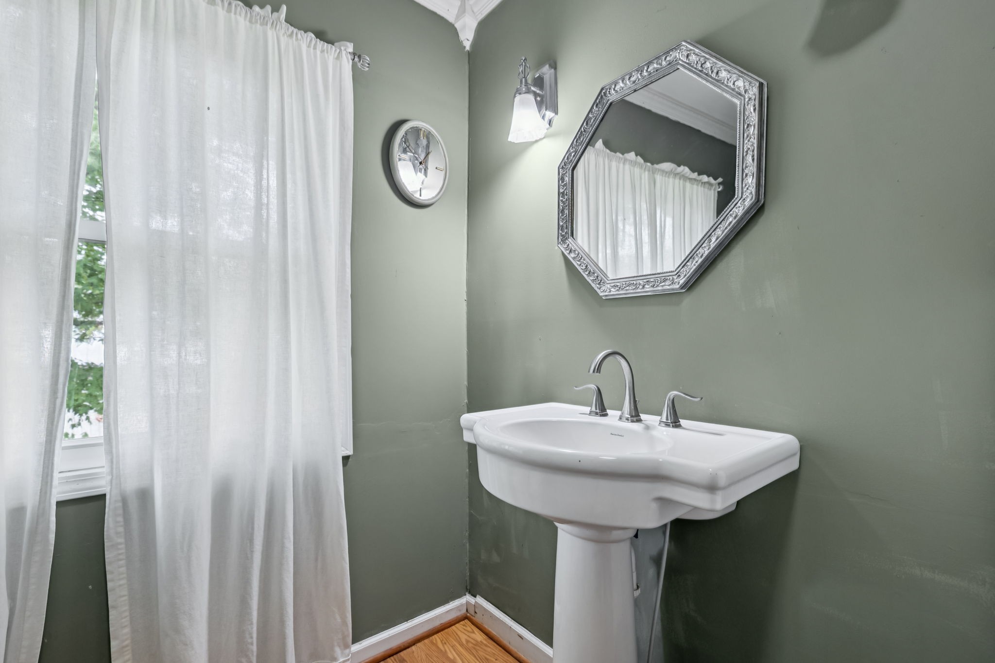 701 Hafner Road Charlotte, TN 37036 - Photo 38 of 52 a bathroom with a sink and a mirror