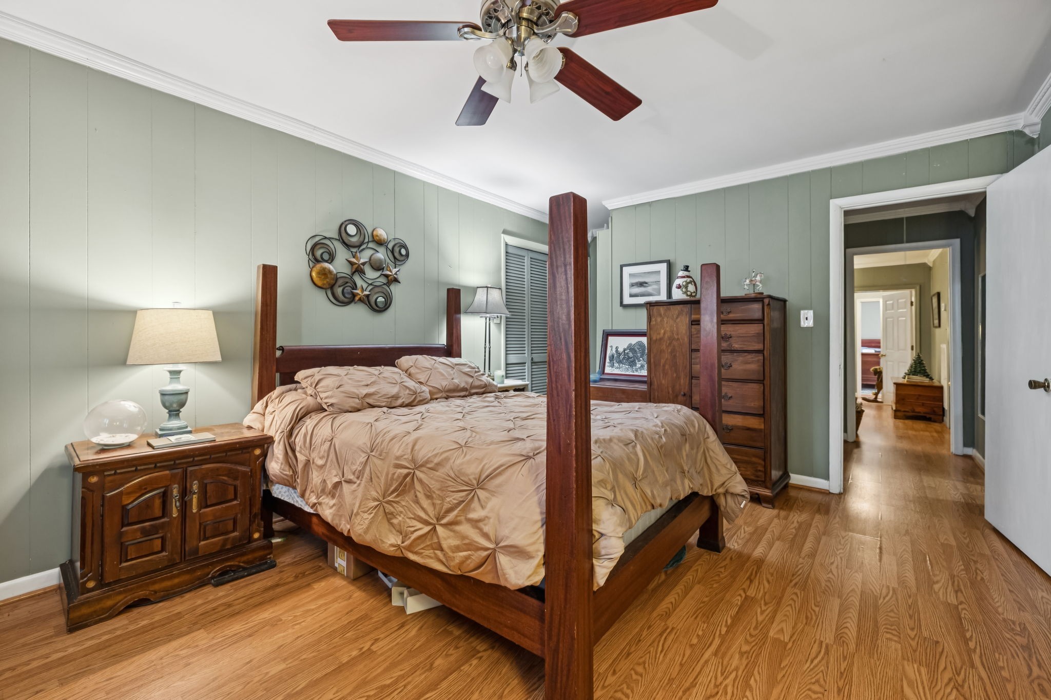 701 Hafner Road Charlotte, TN 37036 - Photo 40 of 52 a bed room with a bed and a chandelier