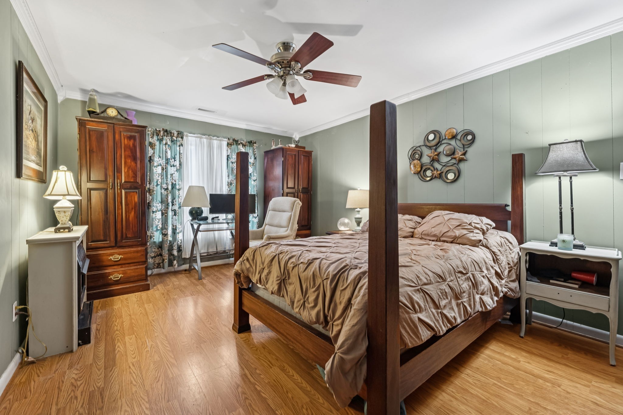 701 Hafner Road Charlotte, TN 37036 - Photo 41 of 52 a bedroom with a bed and wooden floor