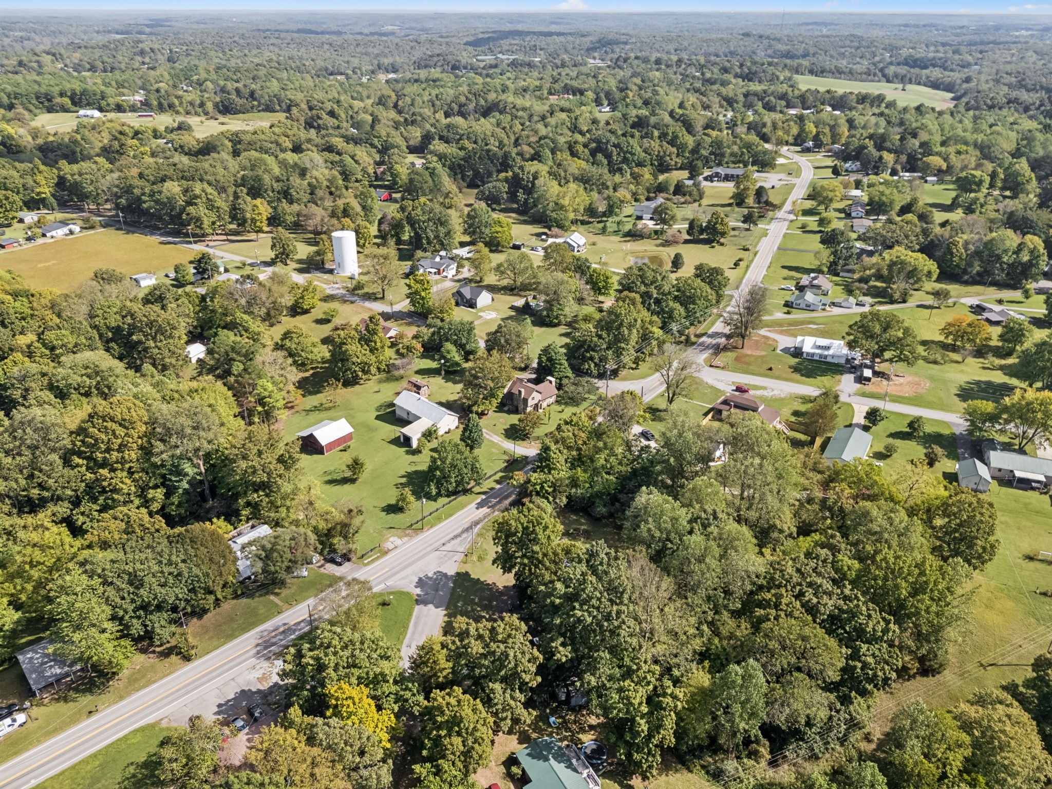 701 Hafner Road Charlotte, TN 37036 - Photo 50 of 52 an aerial view of a residential houses covered in trees