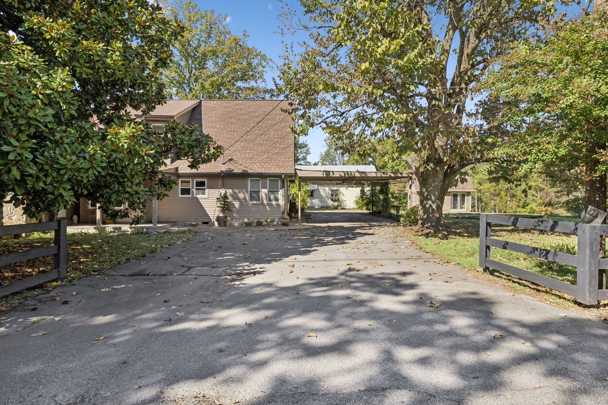 701 Hafner Road Charlotte, TN 37036 - Photo 6 of 52 a view of house with outdoor space and trees