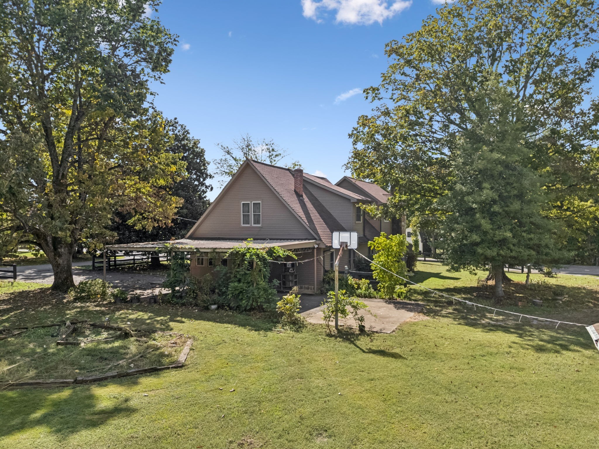 701 Hafner Road Charlotte, TN 37036 - Photo 8 of 52 a backyard of a house with yard table and chairs
