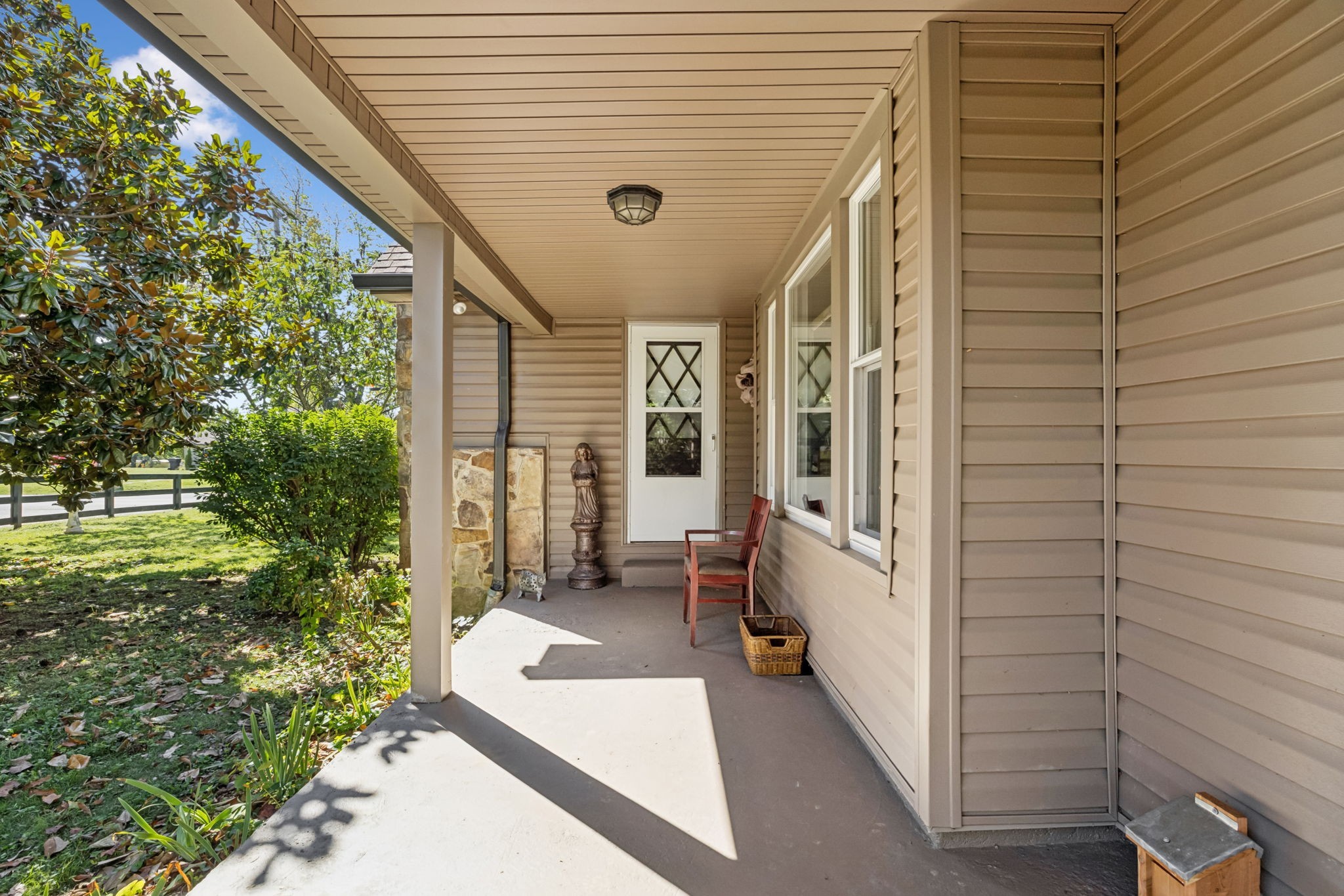 701 Hafner Road Charlotte, TN 37036 - Photo 9 of 52 a view of a porch with furniture and garden