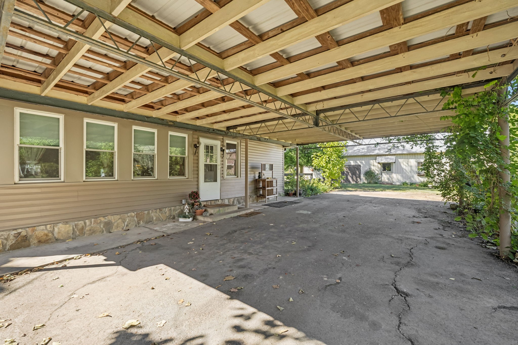 701 Hafner Road Charlotte, TN 37036 - Photo 10 of 52 a view of a house with a backyard