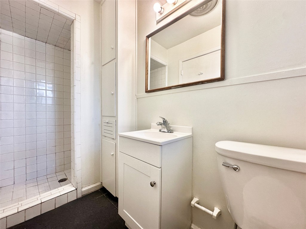 2711 Hemphill Park, Unit A Austin, TX 78705 - Photo 7 of 8 a bathroom with a sink a toilet and shower