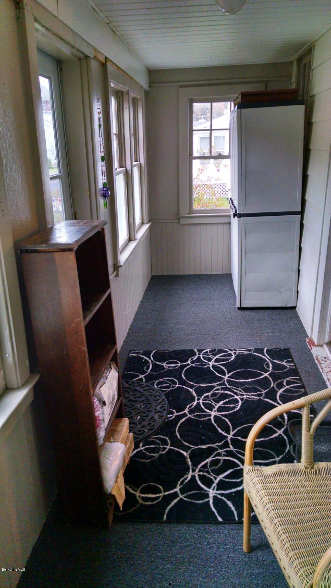 55 Pecks Road Pittsfield, MA 01201 - Photo 3 of 31 Front enclosed porch