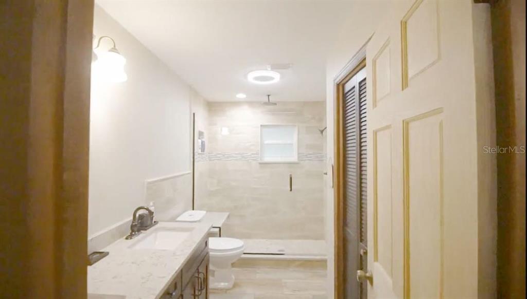 2700 Southeast 157th Lane Road Summerfield, FL 34491 - Photo 12 of 13 a bathroom with a granite countertop sink and a mirror