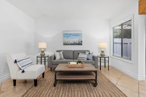 a living room with furniture and a window