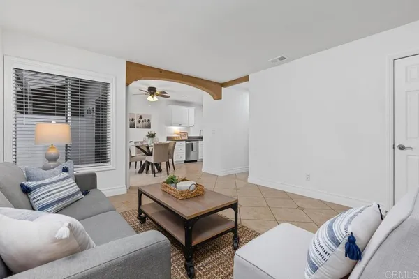 a living room with furniture and a table