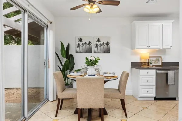 a dining room with furniture and window