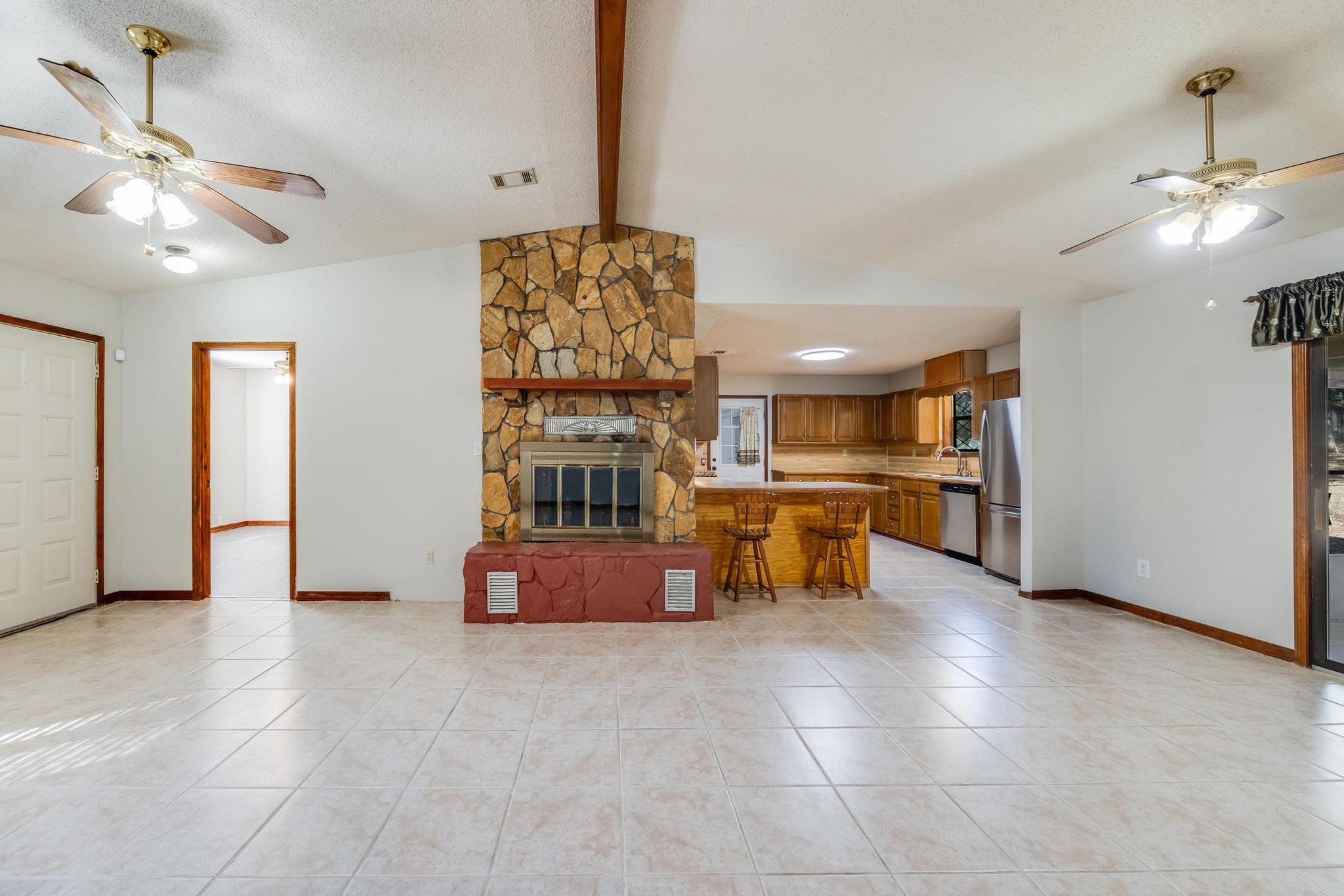 6359 Shangri La Road Crestview, FL 32539 - Photo 16 of 56 a living room with furniture and kitchen view