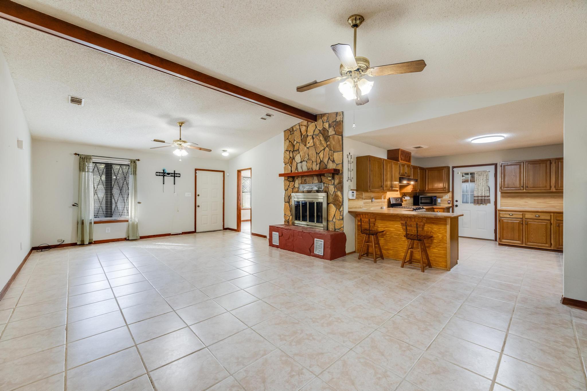 6359 Shangri La Road Crestview, FL 32539 - Photo 19 of 56 a view of an empty room with a kitchen