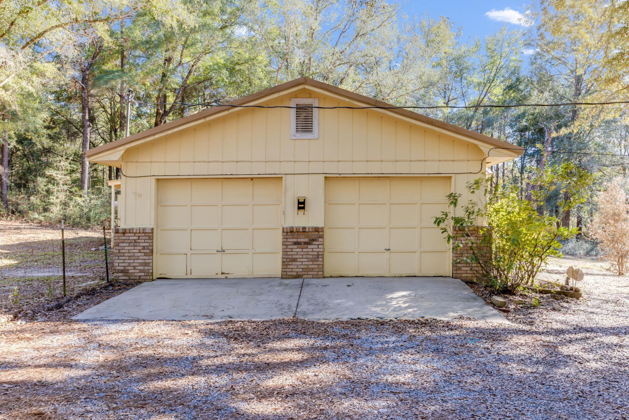 6359 Shangri La Road Crestview, FL 32539 - Photo 2 of 56 a view of a back yard of the house