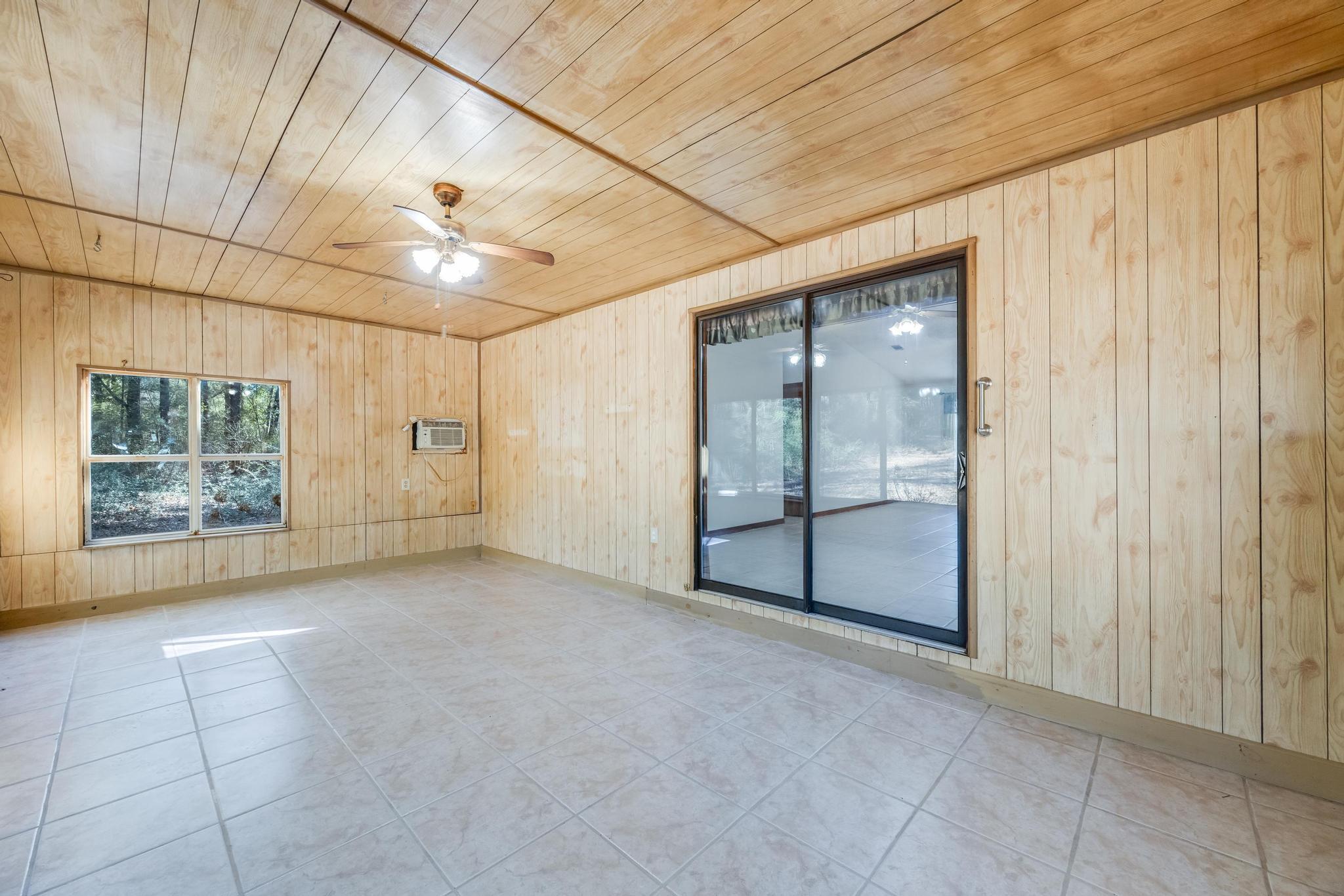 6359 Shangri La Road Crestview, FL 32539 - Photo 26 of 56 an empty room with windows and closet