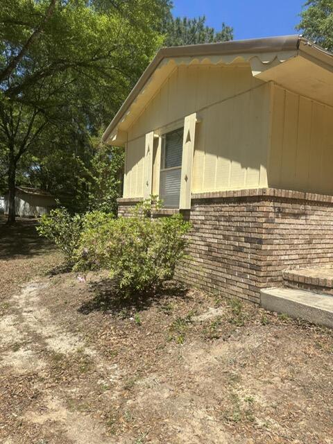 6359 Shangri La Road Crestview, FL 32539 - Photo 3 of 56 a view of a house with a yard