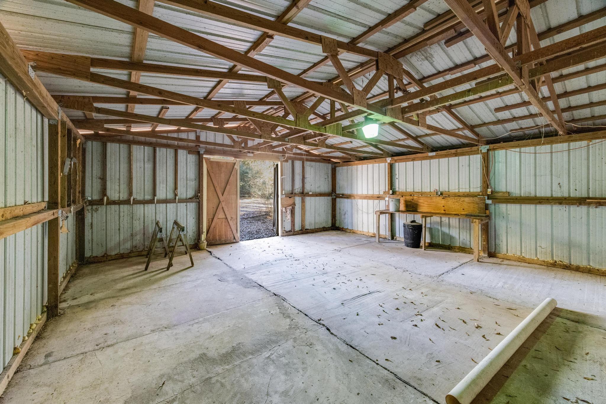 6359 Shangri La Road Crestview, FL 32539 - Photo 51 of 56 a view of storage and utility room with wooden walls