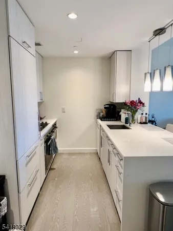 a kitchen with a sink and a stove top oven