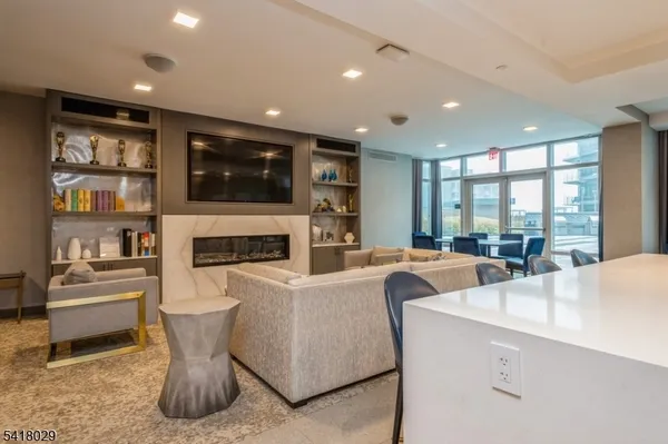 a living room with fireplace furniture and a flat screen tv