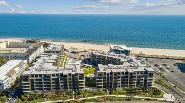 aerial view of a backyard with table and chairs