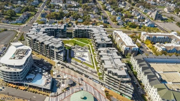 a view of a swimming pool with outdoor seating and city view