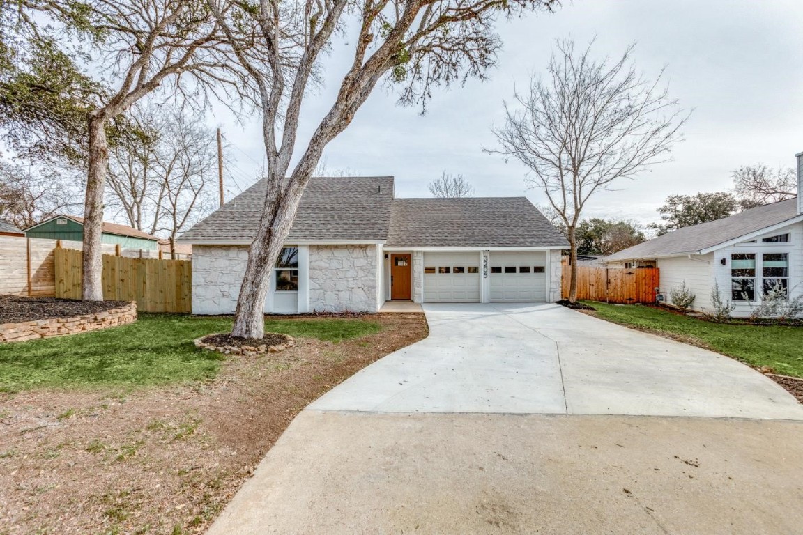 3205 Oak Alley Austin, TX 78745 - Photo 1 of 1 a view of a house with a yard covered in the forest