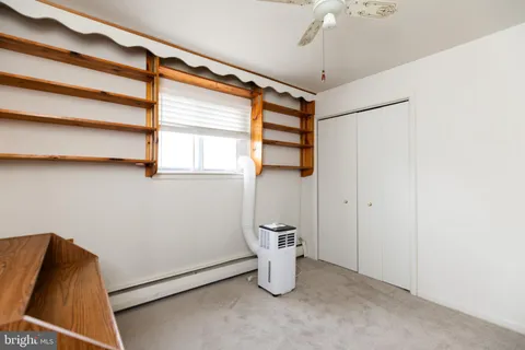 a room with a walk in closet and window