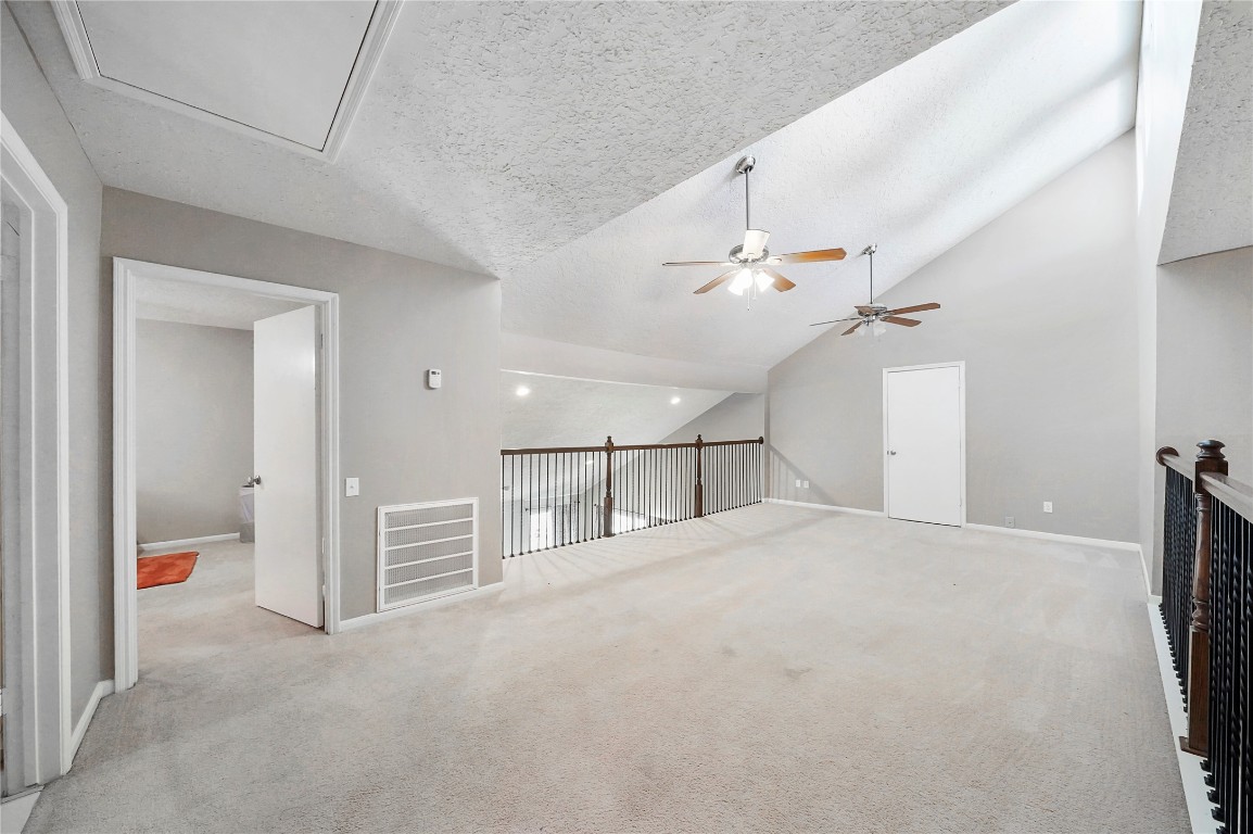 14607 Muirfield Lane Houston, TX 77095 - Photo 11 of 33 a view of a livingroom with a ceiling fan