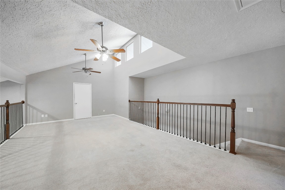 14607 Muirfield Lane Houston, TX 77095 - Photo 12 of 33 a view of a livingroom with a ceiling fan and window
