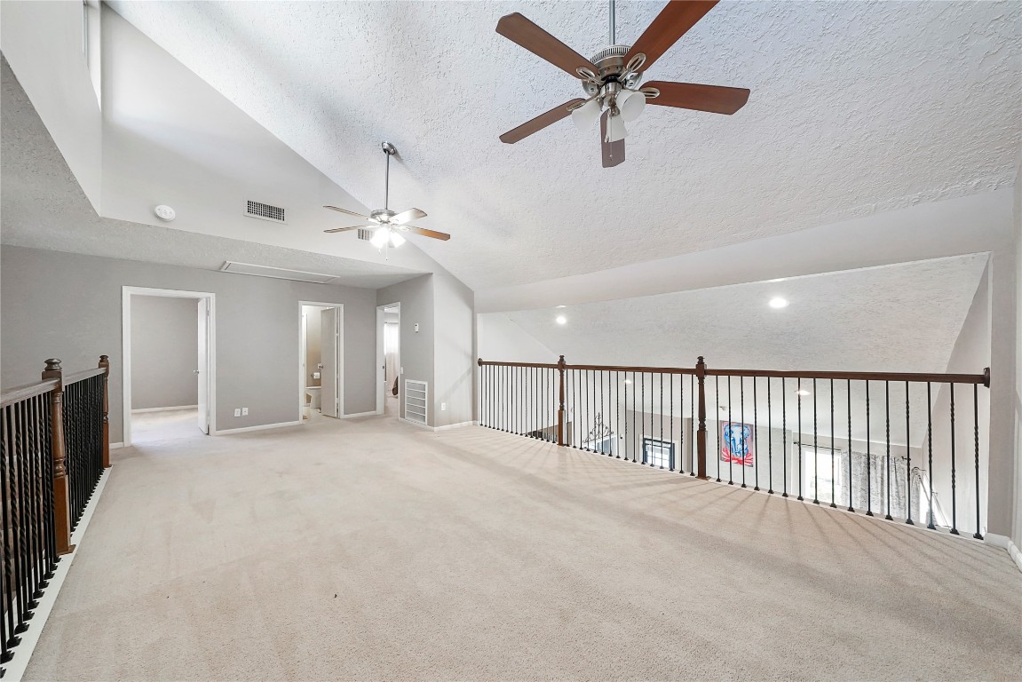 14607 Muirfield Lane Houston, TX 77095 - Photo 14 of 33 a view of a livingroom with a ceiling fan and window