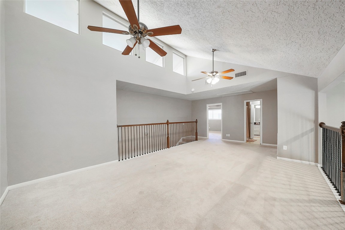 14607 Muirfield Lane Houston, TX 77095 - Photo 15 of 33 a view of a livingroom with a ceiling fan and window