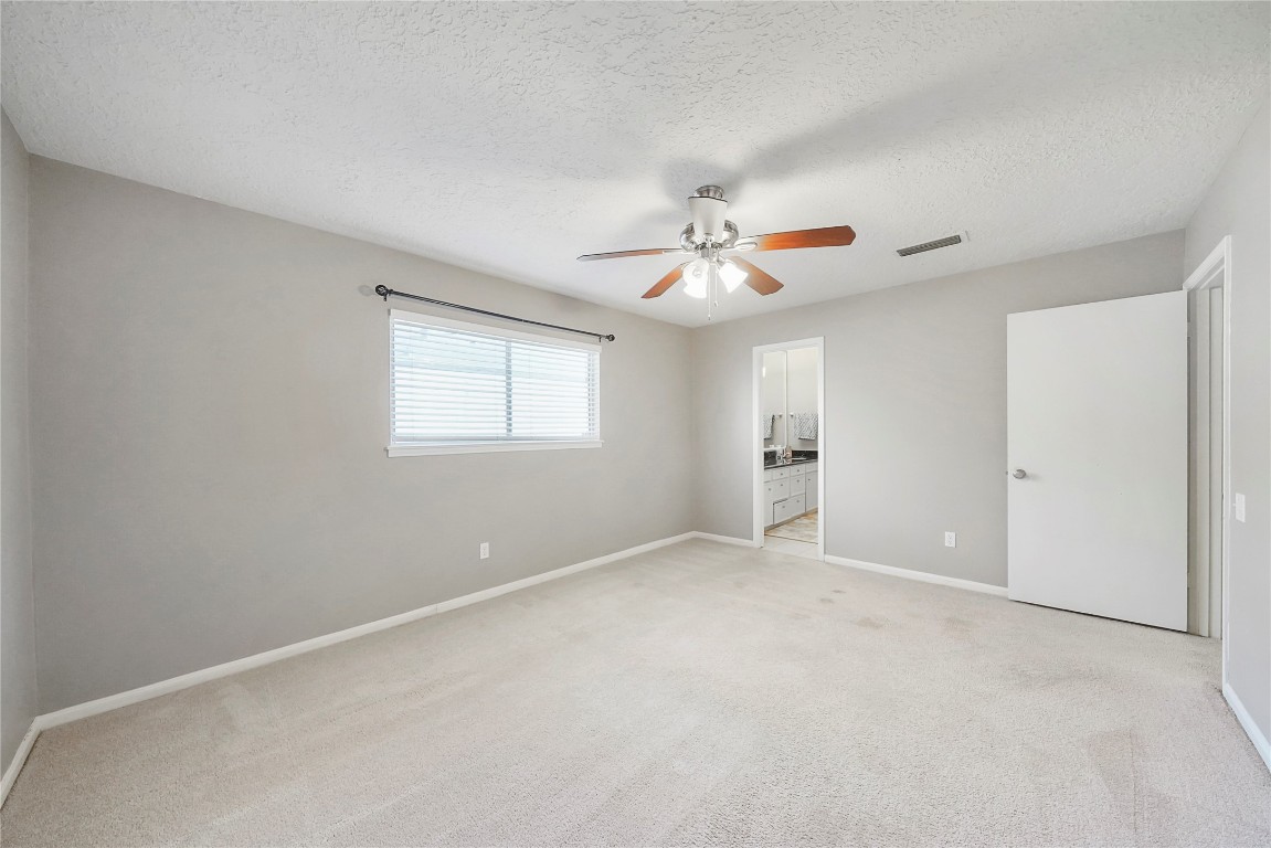 14607 Muirfield Lane Houston, TX 77095 - Photo 17 of 33 a view of an empty room with a window