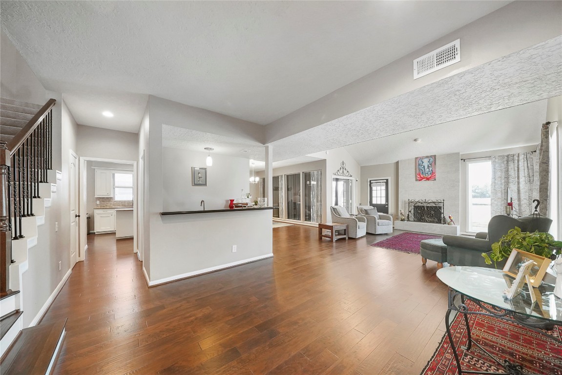 14607 Muirfield Lane Houston, TX 77095 - Photo 22 of 33 a view of living room filled with furniture and wooden floor