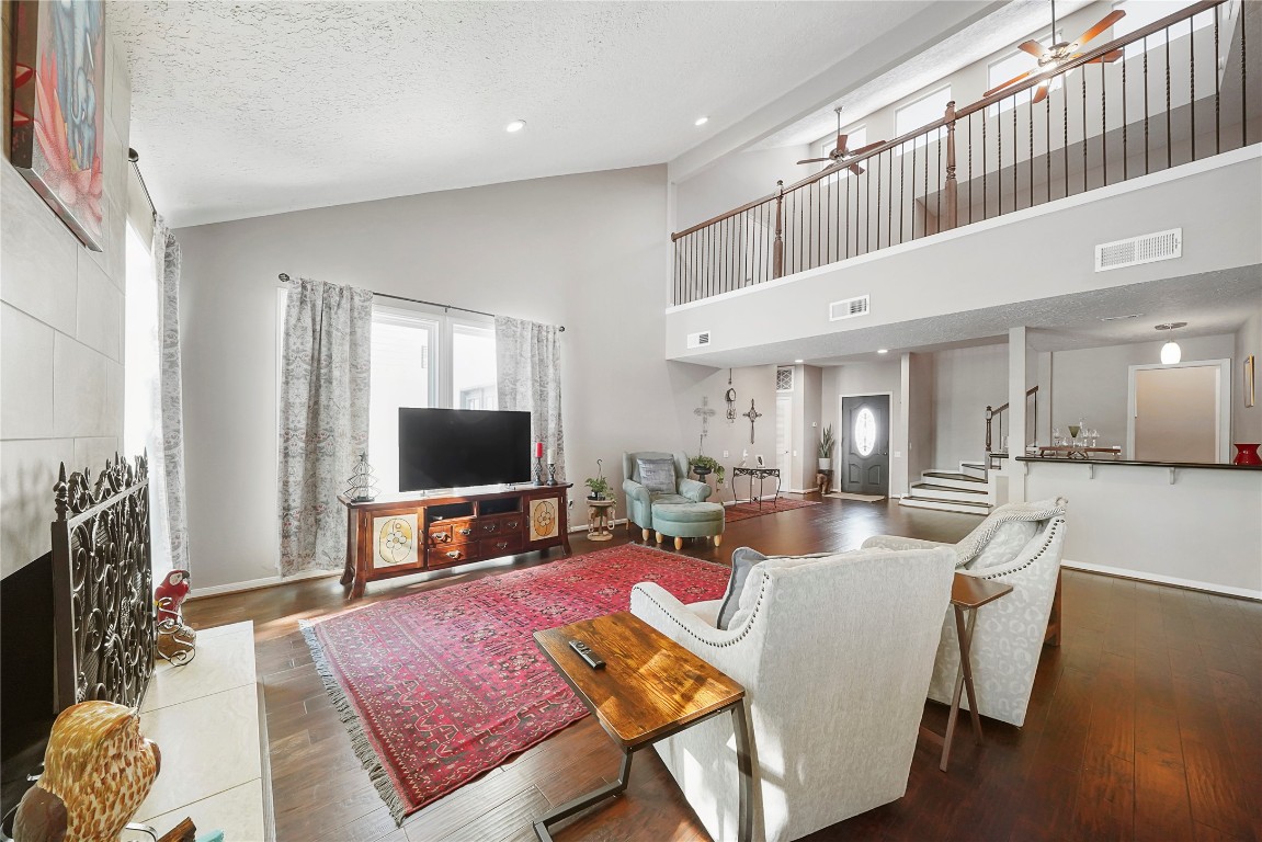 14607 Muirfield Lane Houston, TX 77095 - Photo 26 of 33 a living room with furniture and a flat screen tv