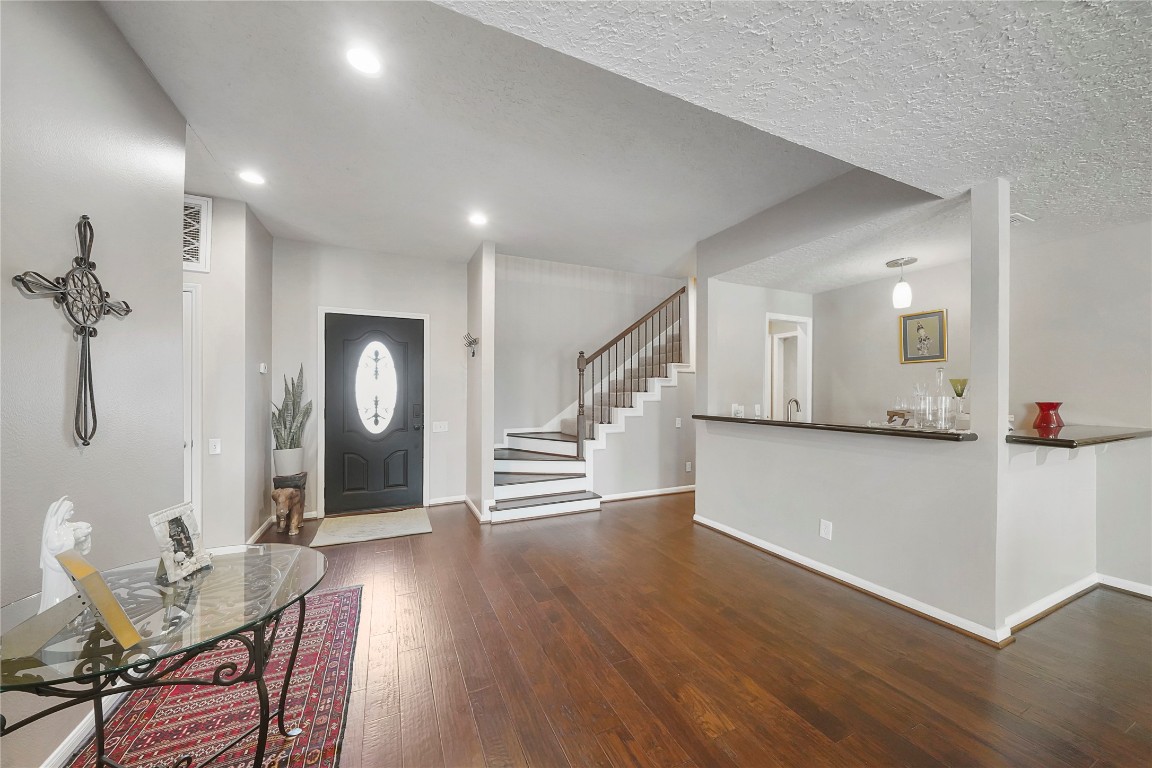 14607 Muirfield Lane Houston, TX 77095 - Photo 28 of 33 a view of a livingroom with furniture and wooden floor