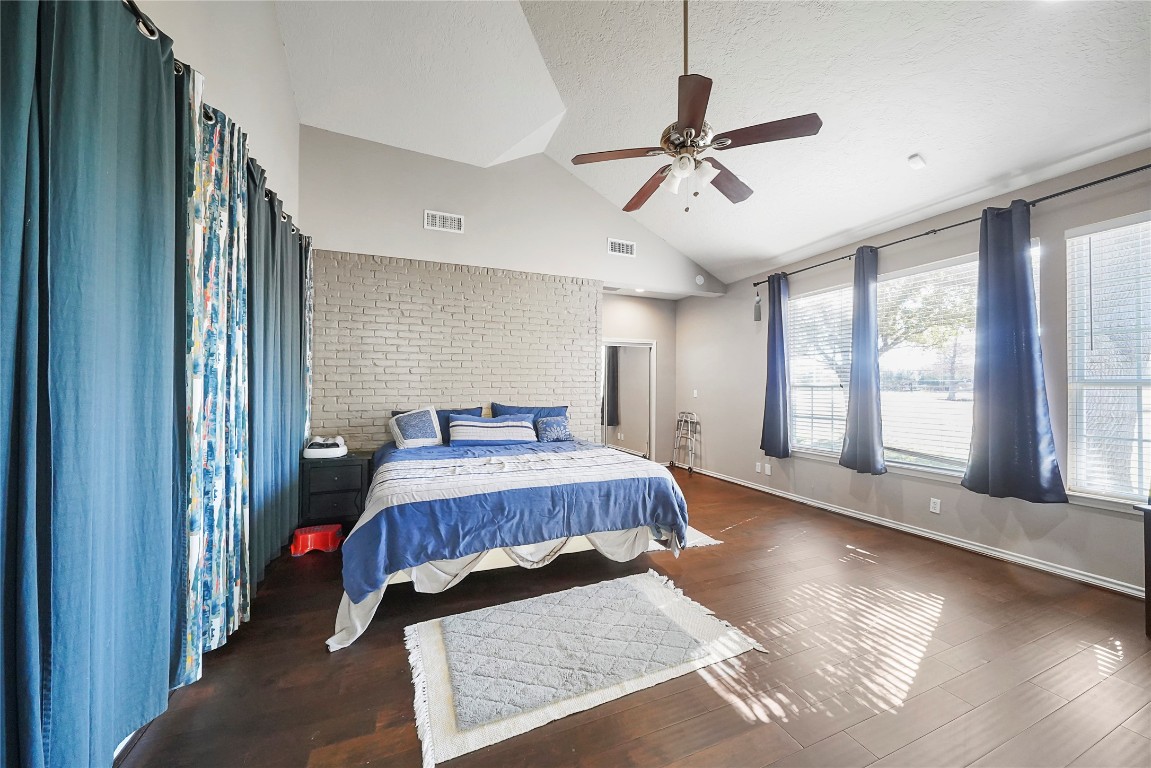 14607 Muirfield Lane Houston, TX 77095 - Photo 29 of 33 a bedroom with a bed and window