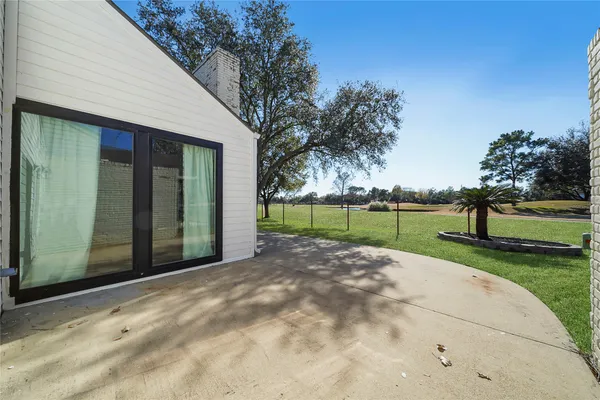 a view of backyard with green space