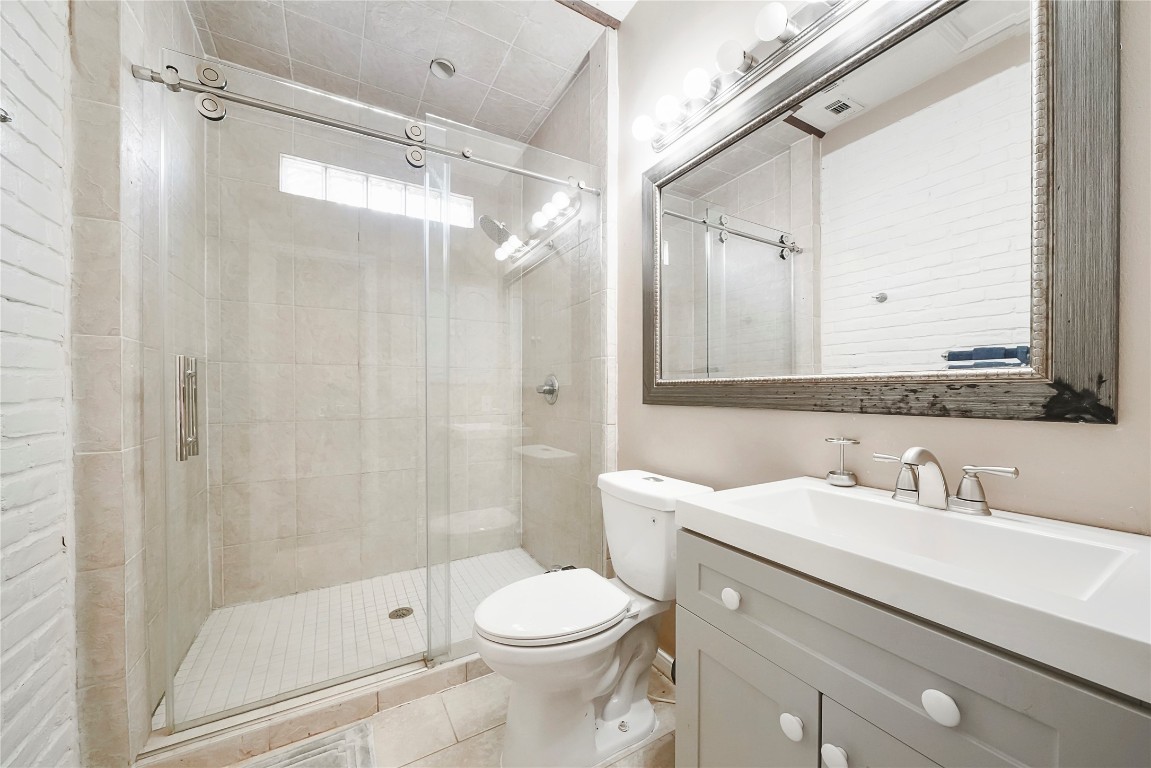 14607 Muirfield Lane Houston, TX 77095 - Photo 31 of 33 a bathroom with a sink toilet and shower