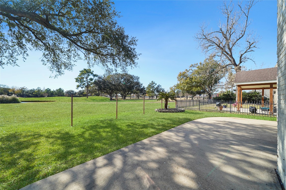 14607 Muirfield Lane Houston, TX 77095 - Photo 5 of 33 a view of a house with a big yard and potted plants