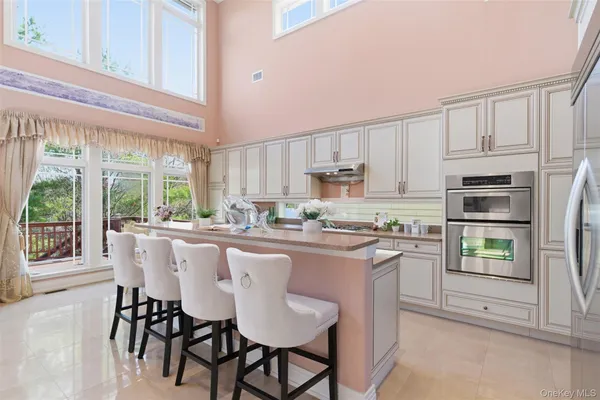 a bathroom with a granite countertop sink mirror and double
