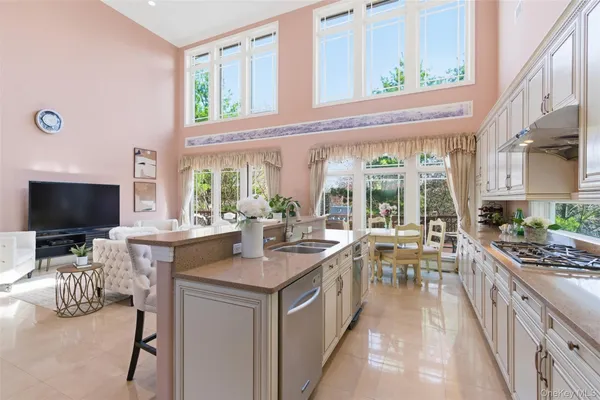 a spacious bathroom with a granite countertop sink a toilet and a shower