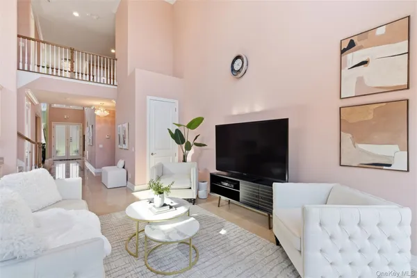 a bedroom with a bed and a flat tv screen