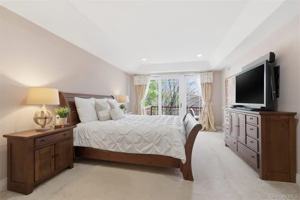 a room with pool table and windows