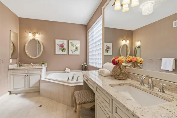 a view of a roof deck with table and chairs and wooden floor