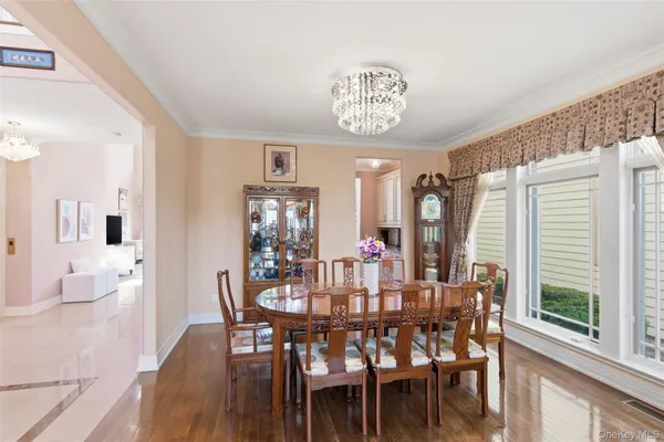 a view of a dining room with furniture window and wooden floor