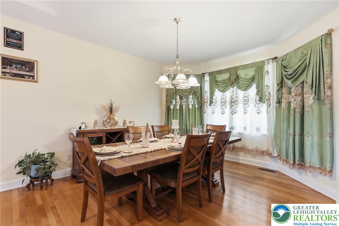 5217 Cider Press Road Schnecksville, PA 18078 - Photo 14 of 54 a view of a dining room with furniture window and wooden floor