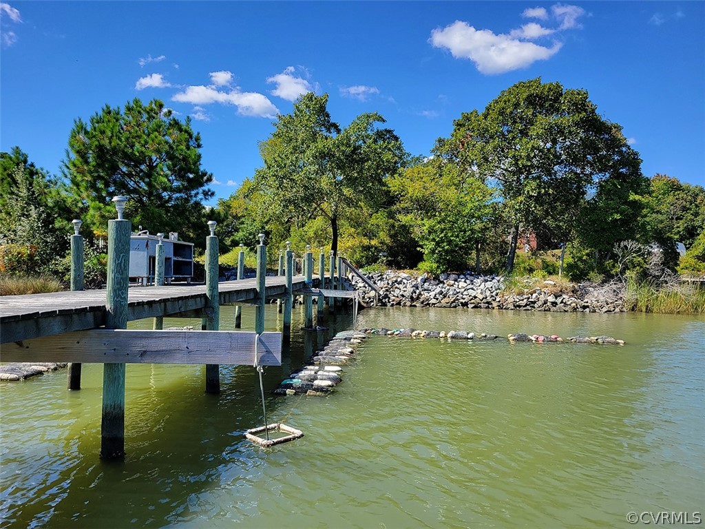 405 Locklies Creek Road Topping, VA 23169 - Photo 11 of 30 a view of swimming pool with outdoor seating and yard
