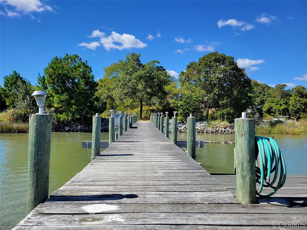 405 Locklies Creek Road Topping, VA 23169 - Photo 12 of 30 a park view with a bench in the patio