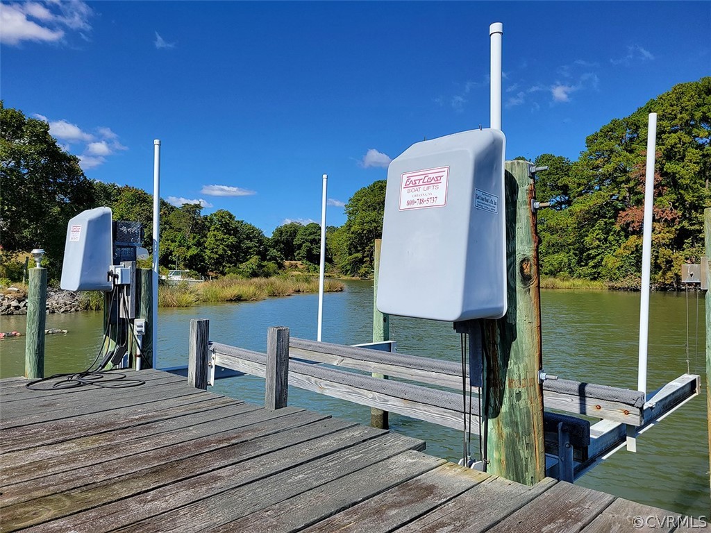 405 Locklies Creek Road Topping, VA 23169 - Photo 15 of 30 a front view of a house with a garden