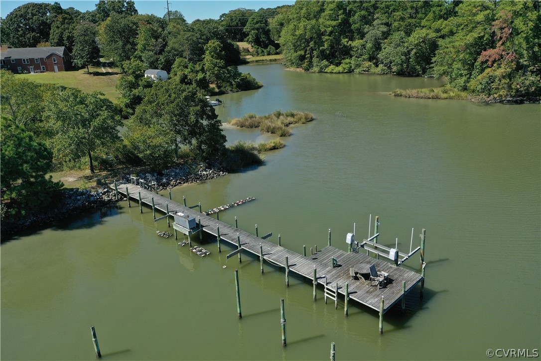 405 Locklies Creek Road Topping, VA 23169 - Photo 16 of 30 an aerial view of a house with outdoor space and lake view